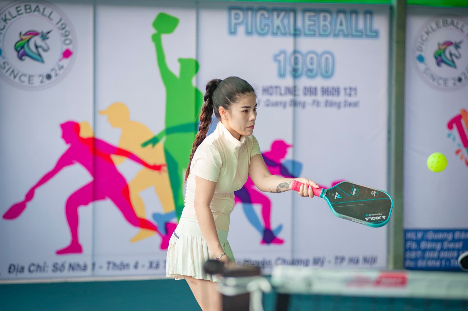 Pickleball player mid-rally, quick lateral movements that drive many of the injuries we treat.